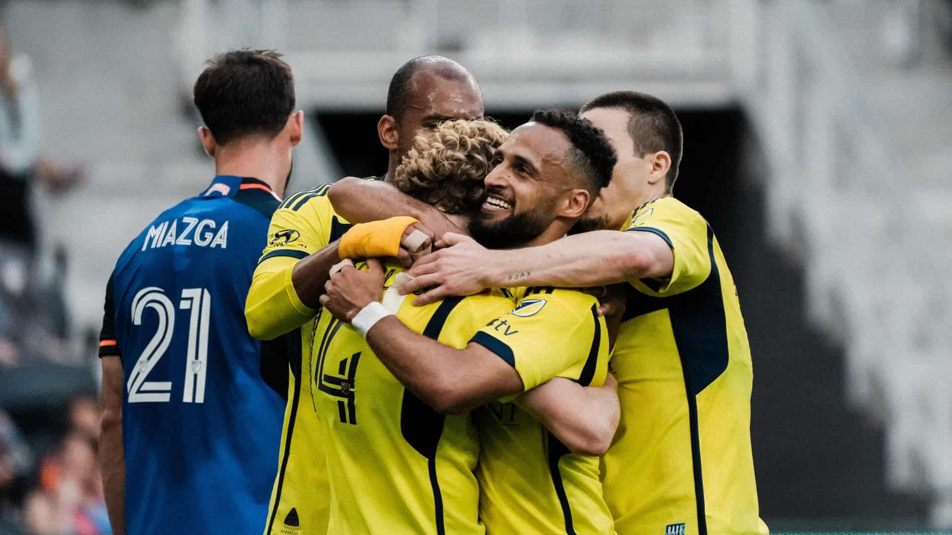 mukhtar and shaffelburg celebrate following a goal